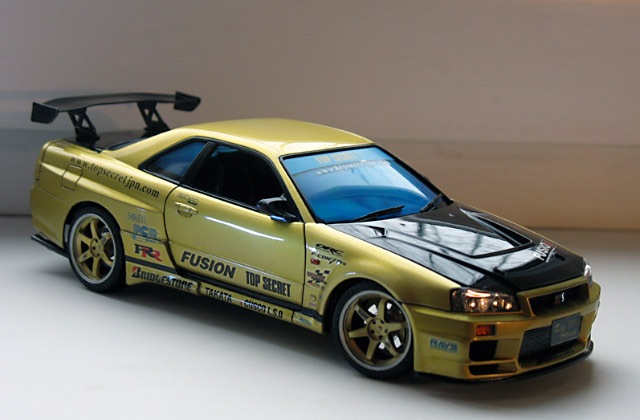 Модель skyline r34. Nissan Skyline r34 Aoshima. Aoshima Nissan Skyline gt-r r34. Ниссан Скайлайн 34 сборная модель. Nissan Skyline GTR r34 Top Secret.